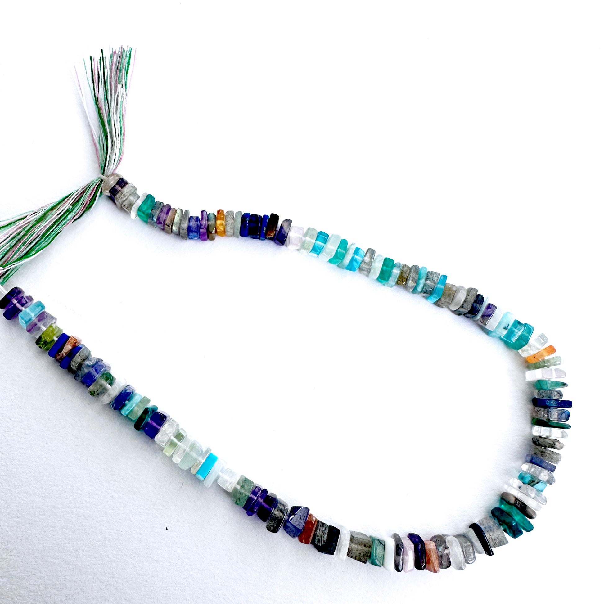 Flat-disc beads with smooth finish for handmade jewellery components.