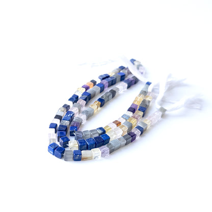 Genuine Disco gemstone beads displaying mixed tones, polished surfaces, and a neatly arranged 23cm strand for jewellery design.