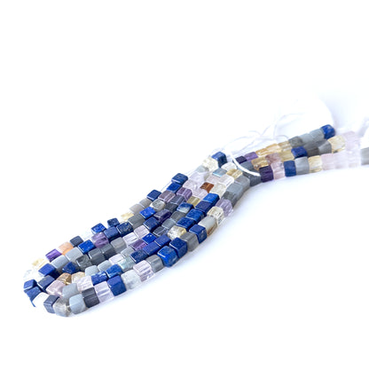 Handmade jewellery components featuring natural Disco smooth square beads, highlighting their colour, shape, and glossy finish.