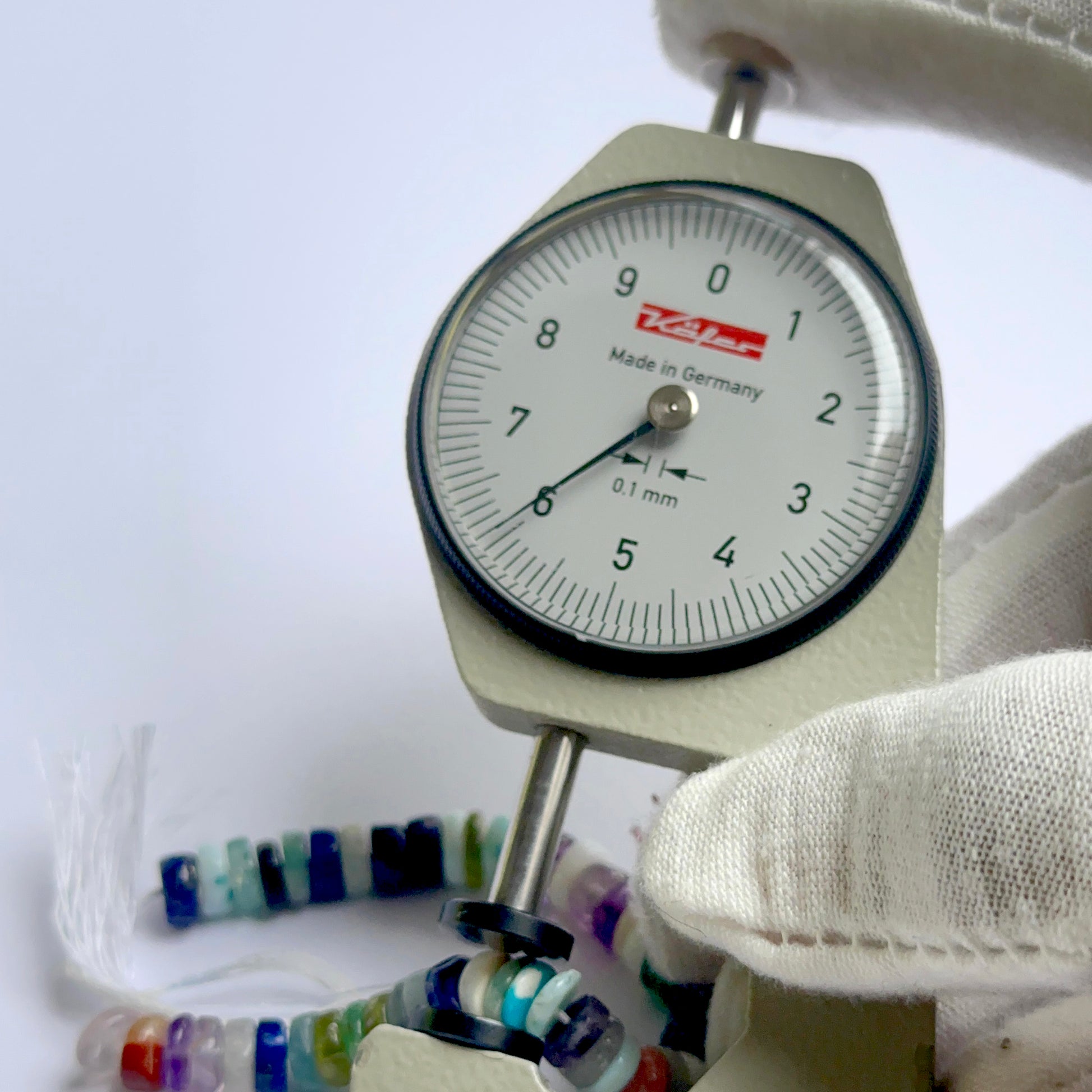 A dial gauge measures the disco smooth wheel 6mm gemstone.