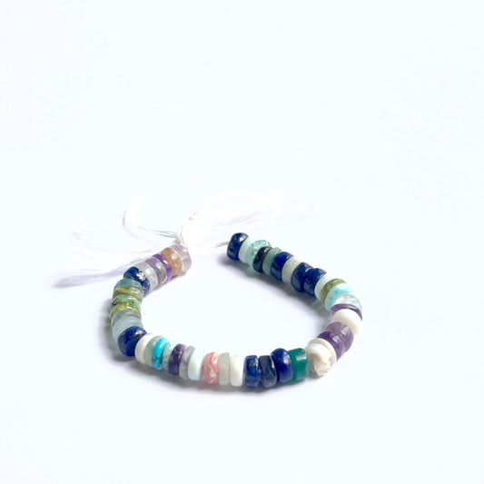 Disco smooth wheel beads displayed with smooth surfaces ideal for jewellery making.