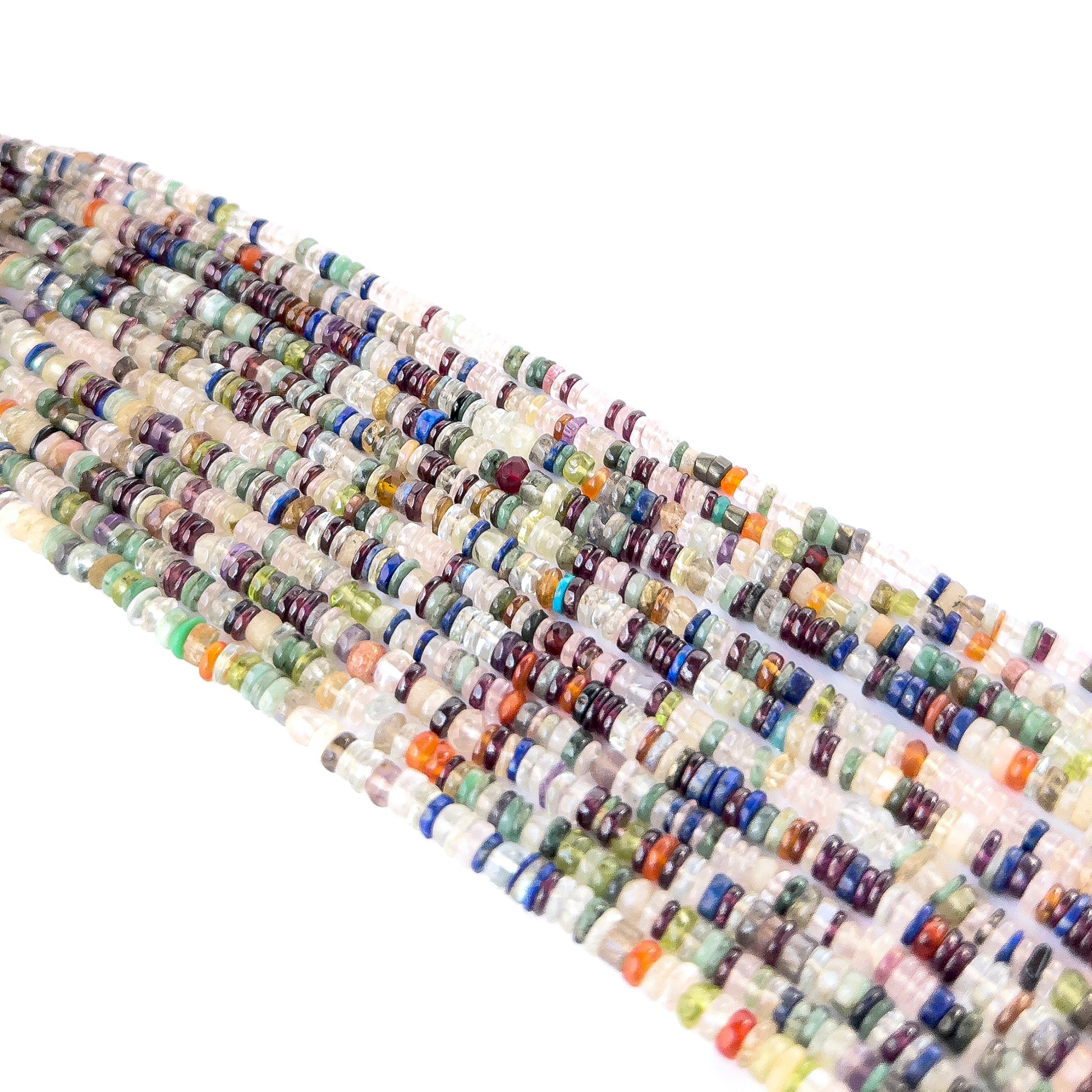 Premium smooth wheel heishi beads showcasing polished surfaces and uniform shape for artisan designs.