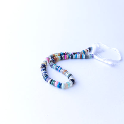 Genuine Disco gemstone beads in smooth wheel heishi cut, displaying polish, texture, and natural colour variation.