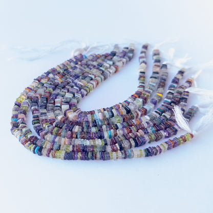 Close‑up of genuine Disco square heishi beads highlighting their shine, carved texture and vibrant multicolour tones.
