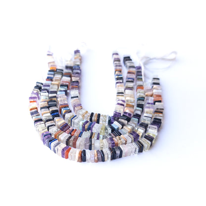 Close‑up of authentic Disco square heishi stone beads showing texture and shine for DIY jewellery making.