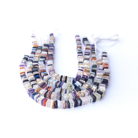 Close‑up of authentic Disco square heishi stone beads showing texture and shine for DIY jewellery making.