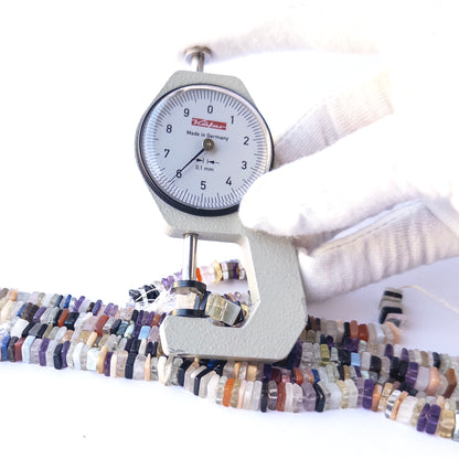 A dial gauge measures the Disco square heishi 5–7mm gemstone.