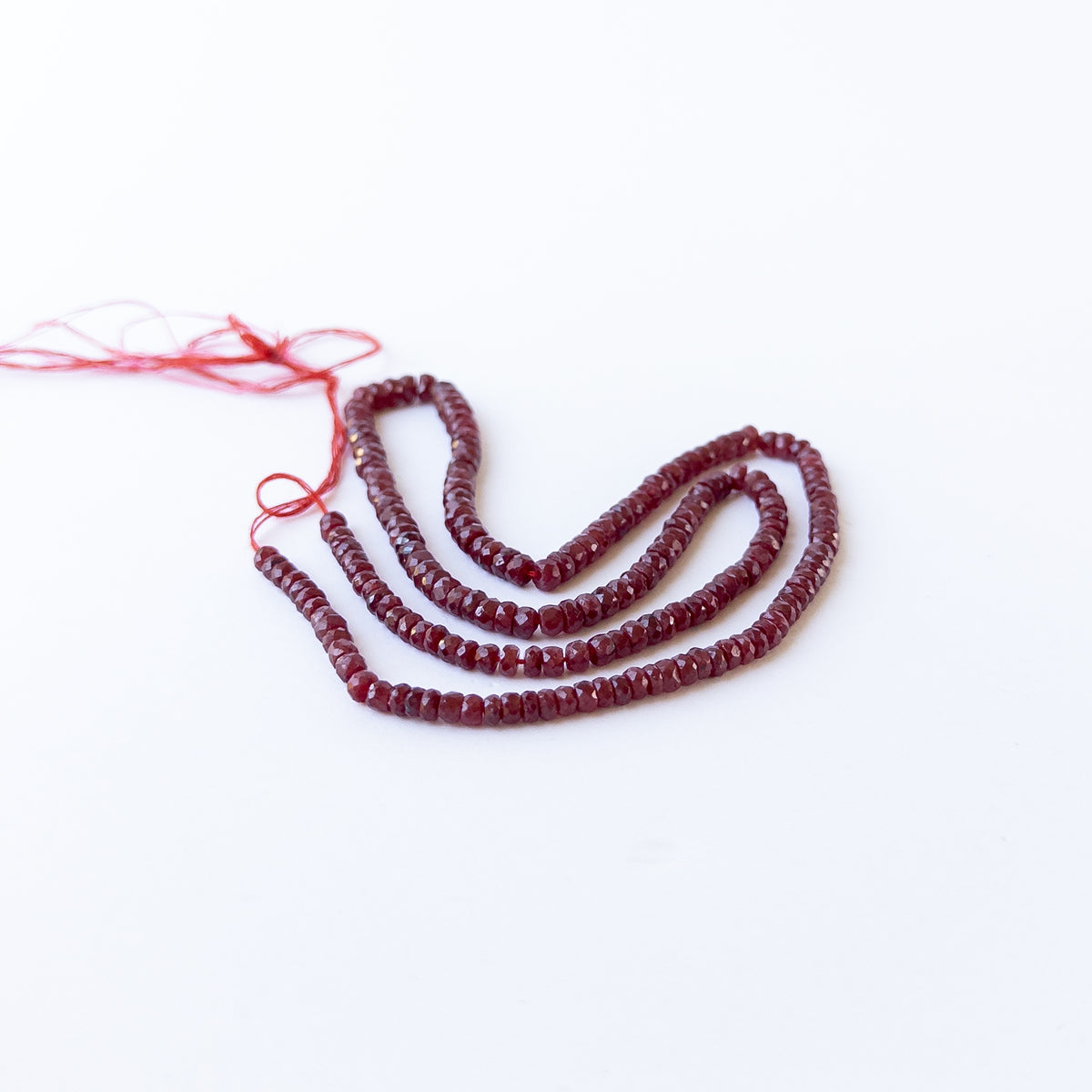 Sparkling dyed Ruby rondelle beads in assorted 3.6–5mm sizes for artisan jewellery components.