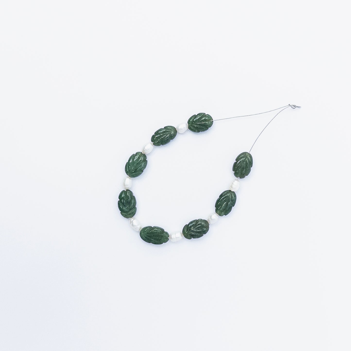 High‑quality Emerald and Pearl stone beads in carved shapes, perfect for DIY jewellery makers seeking unique combinations.