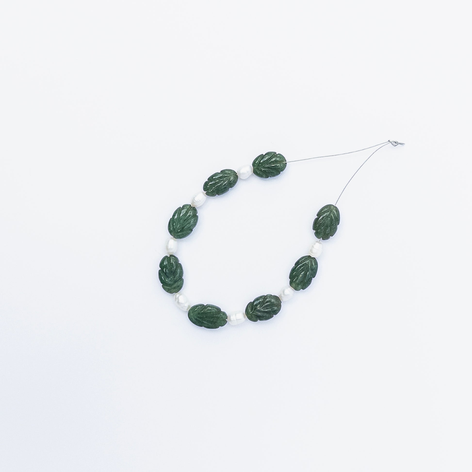 High‑quality Emerald and Pearl stone beads in carved shapes, perfect for DIY jewellery makers seeking unique combinations.