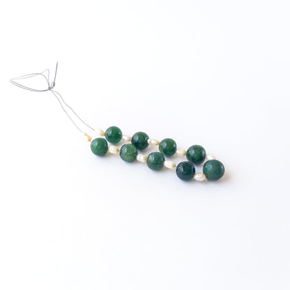 Handmade jewellery components featuring Emerald and Freshwater Pearls with consistent sizing and bright lustre.