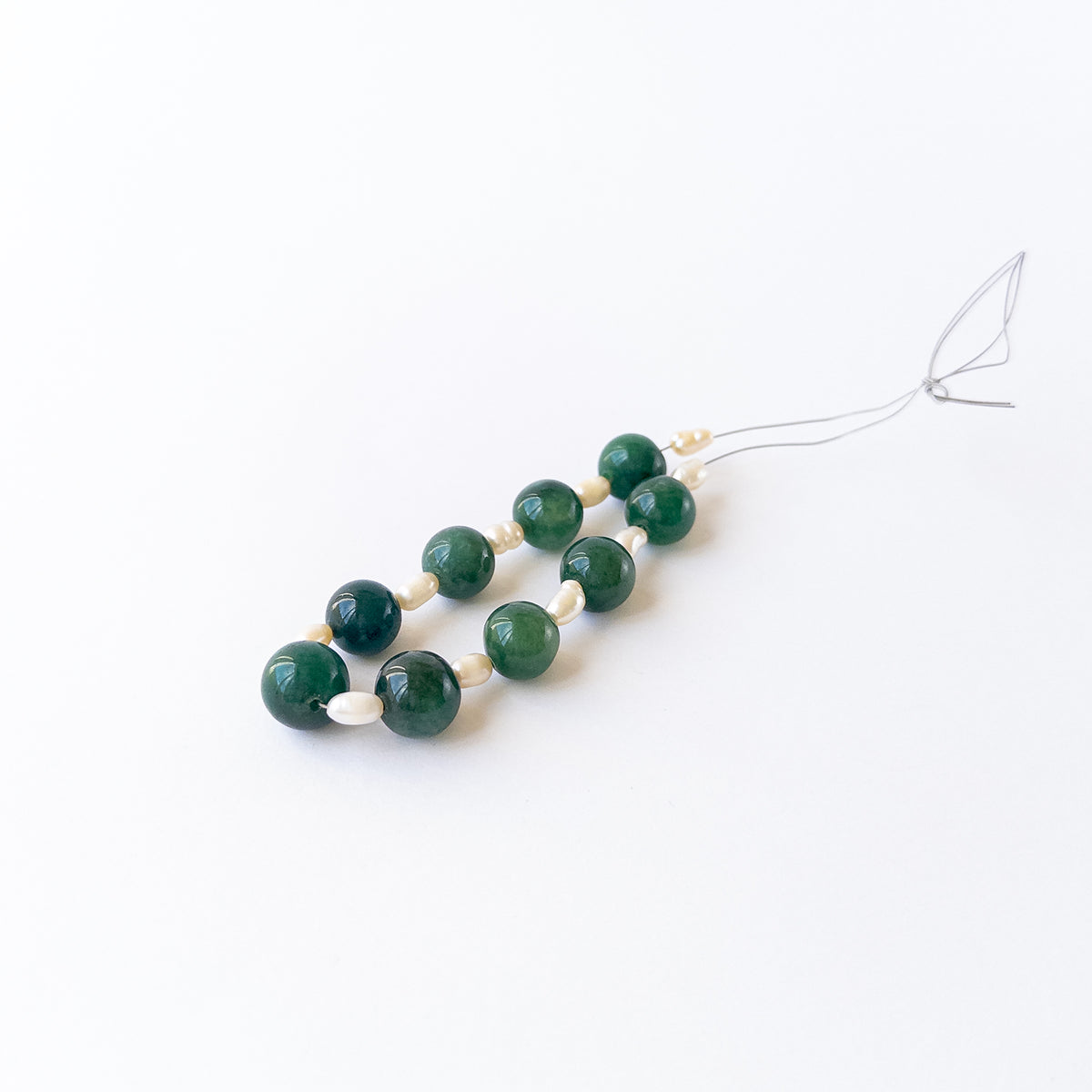 High‑quality smooth round beads with polished shine and refined arrangement ideal for handcrafted jewellery.