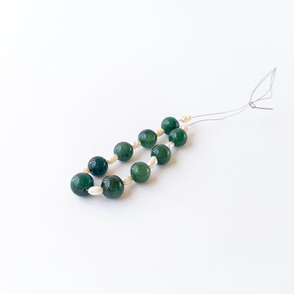 High‑quality smooth round beads with polished shine and refined arrangement ideal for handcrafted jewellery.
