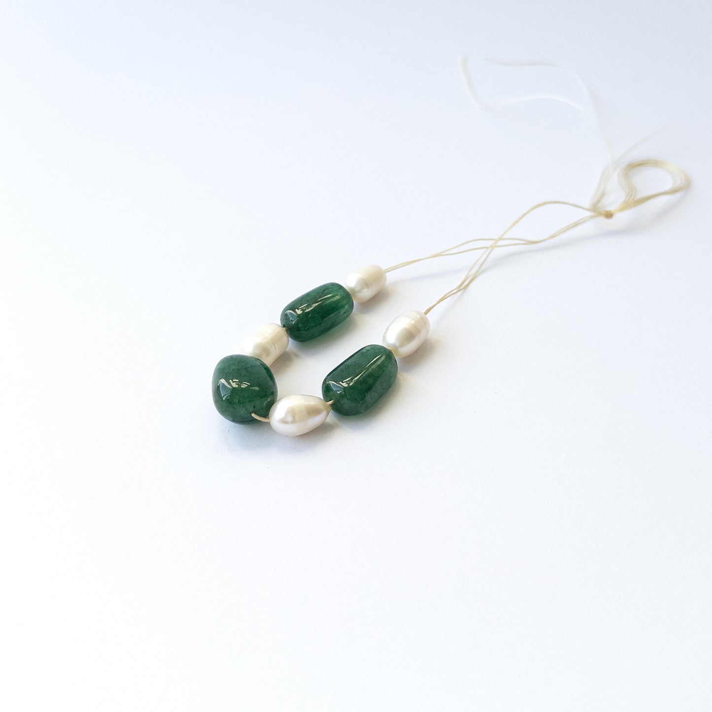 Natural Emerald and pearl beads with soft shine and smooth tumble shapes, ideal for artisan jewellery components.