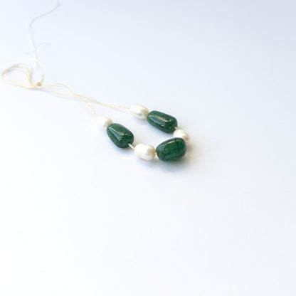 Handmade jewellery components using premium Emerald and freshwater pearl tumbles with elegant green and white tones.