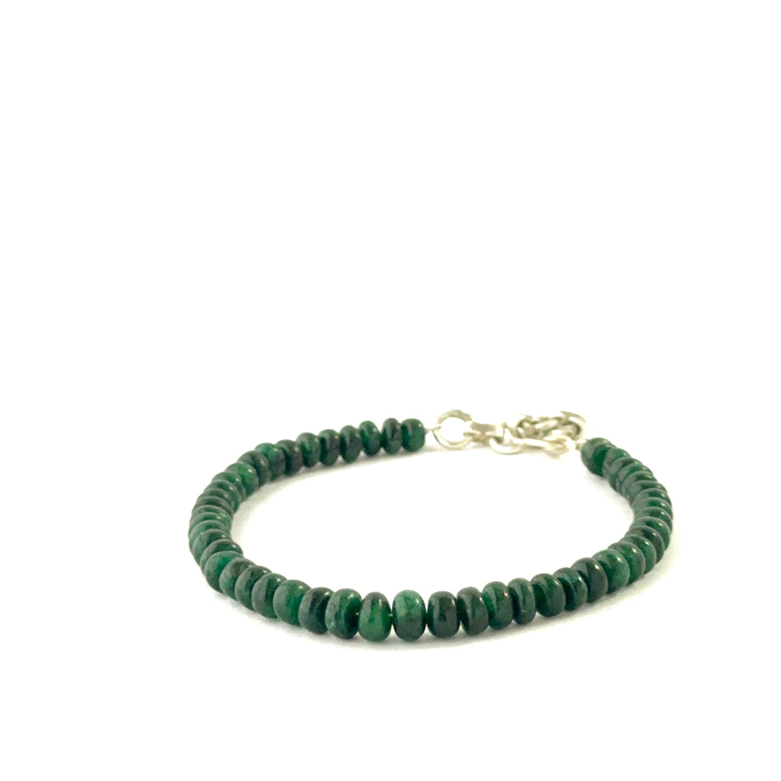 Elegant emerald bracelet showcasing smooth rondelle beads sized 5.5–5.9mm.