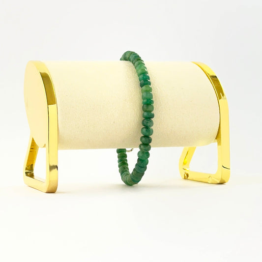 Elegant smooth rondelle emerald bracelet crafted in a single adjustable strand.