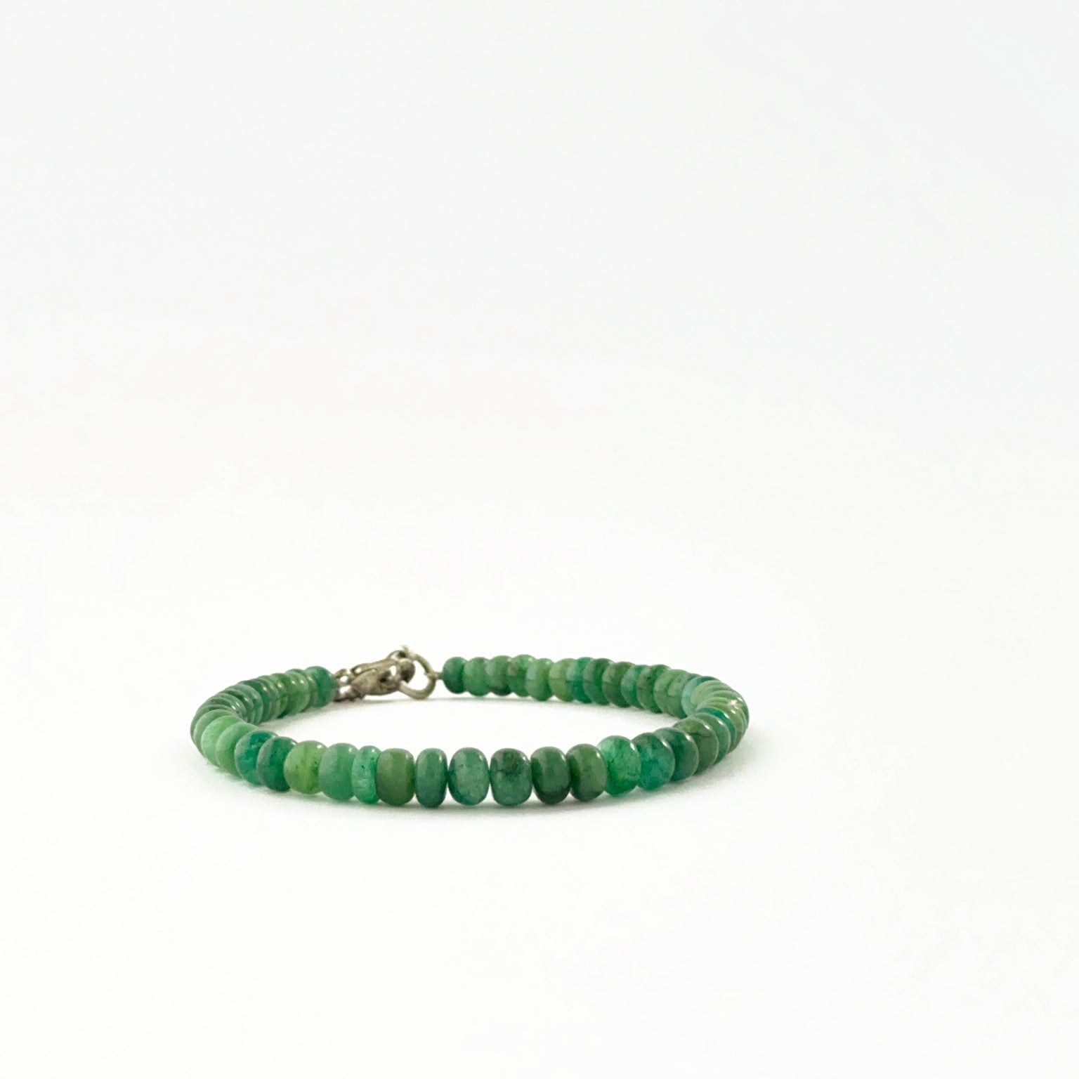 Emerald bead bracelet showcasing smooth 5.2–6mm rondelle beads.