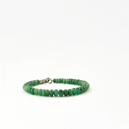 Emerald bead bracelet showcasing smooth 5.2–6mm rondelle beads.