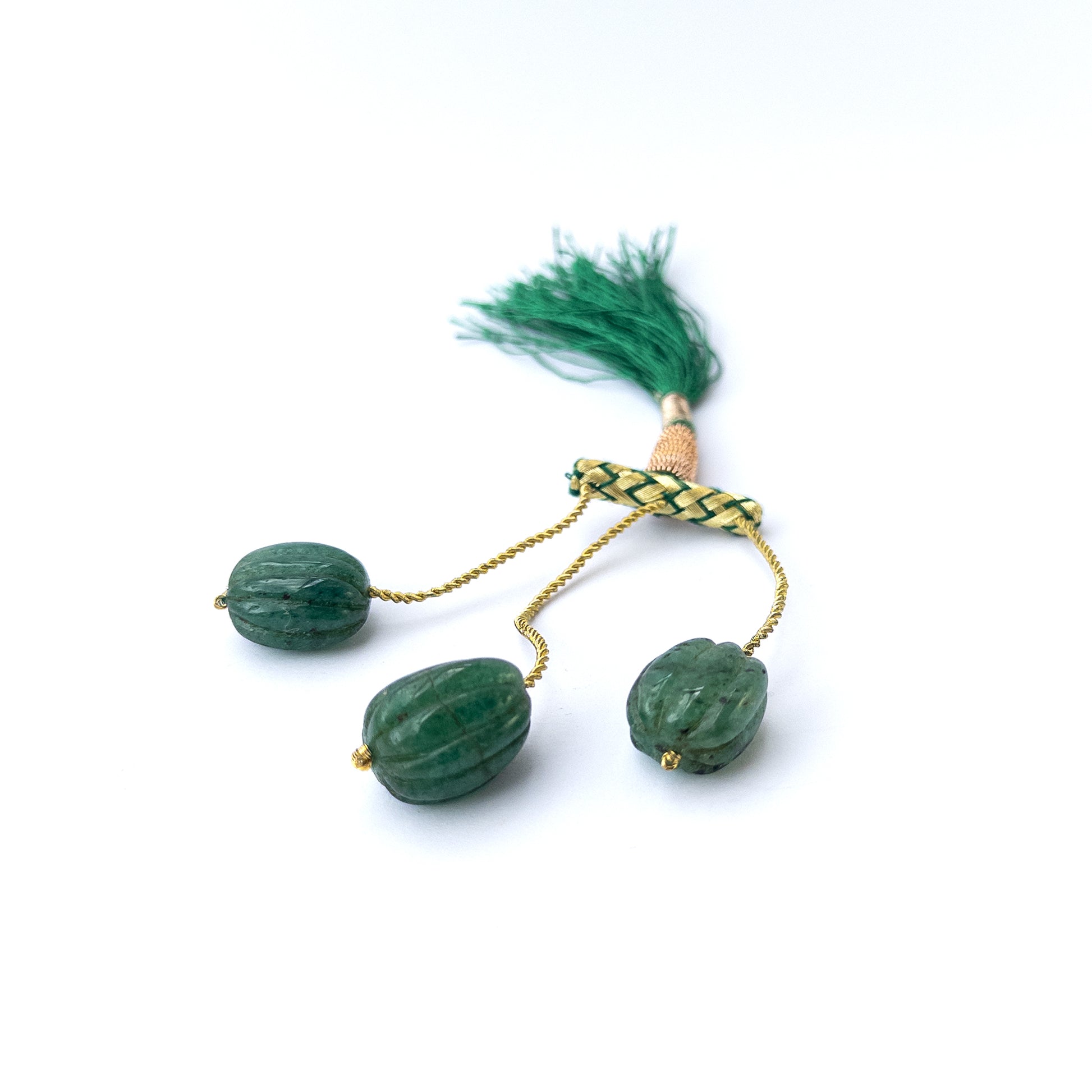 Authentic Emerald gemstone beads featuring detailed carved oval designs ideal for DIY jewellery making.