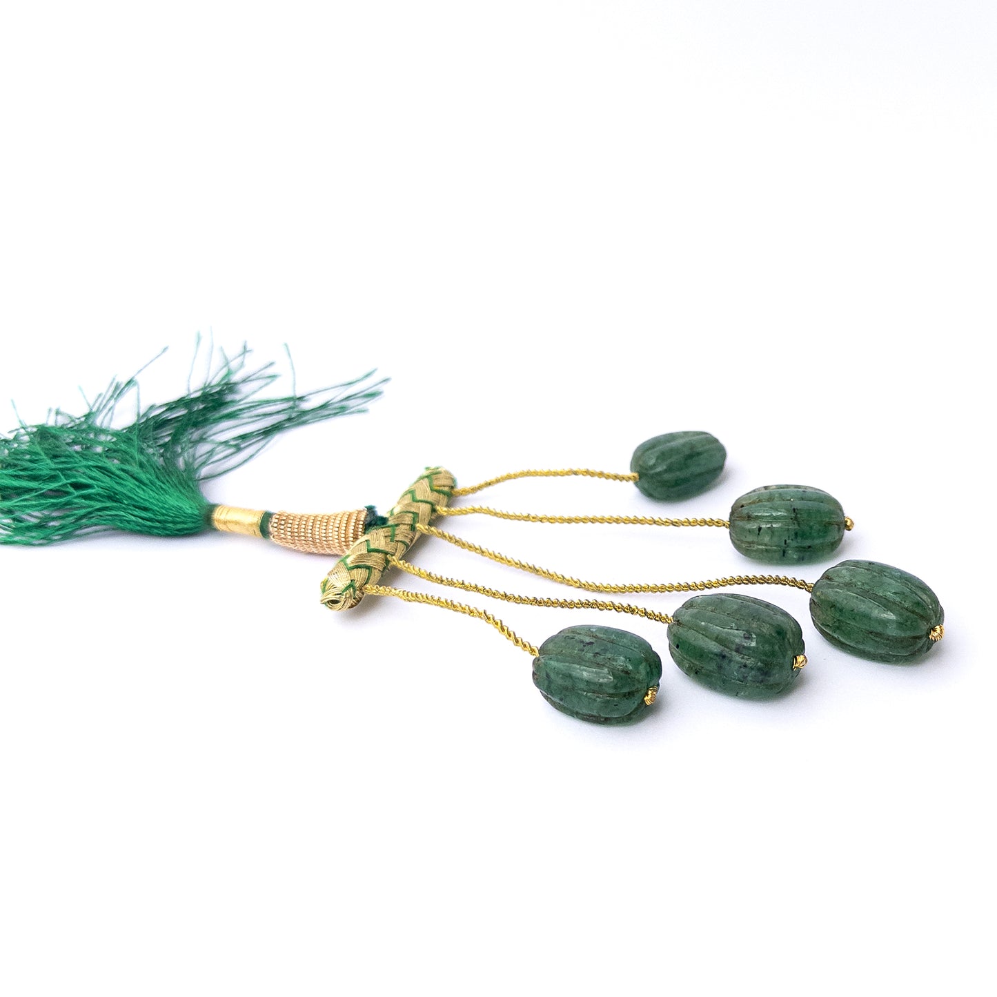 Vibrant green emerald beads in carved oval form, perfect for gemstone beads for DIY jewellery projects.
