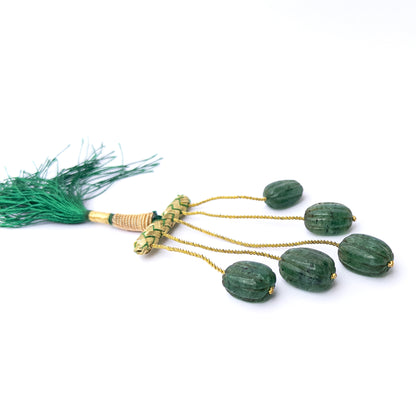 Vibrant green emerald beads in carved oval form, perfect for gemstone beads for DIY jewellery projects.