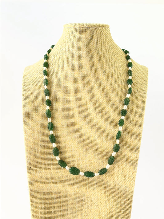 Single‑strand emerald necklace featuring carved oval 8–8.5mm beads in a 52cm adjustable design.