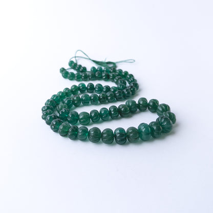 Genuine Emerald gemstone beads with carved pumpkin detailing, ideal for DIY jewellery and artisan beadwork.