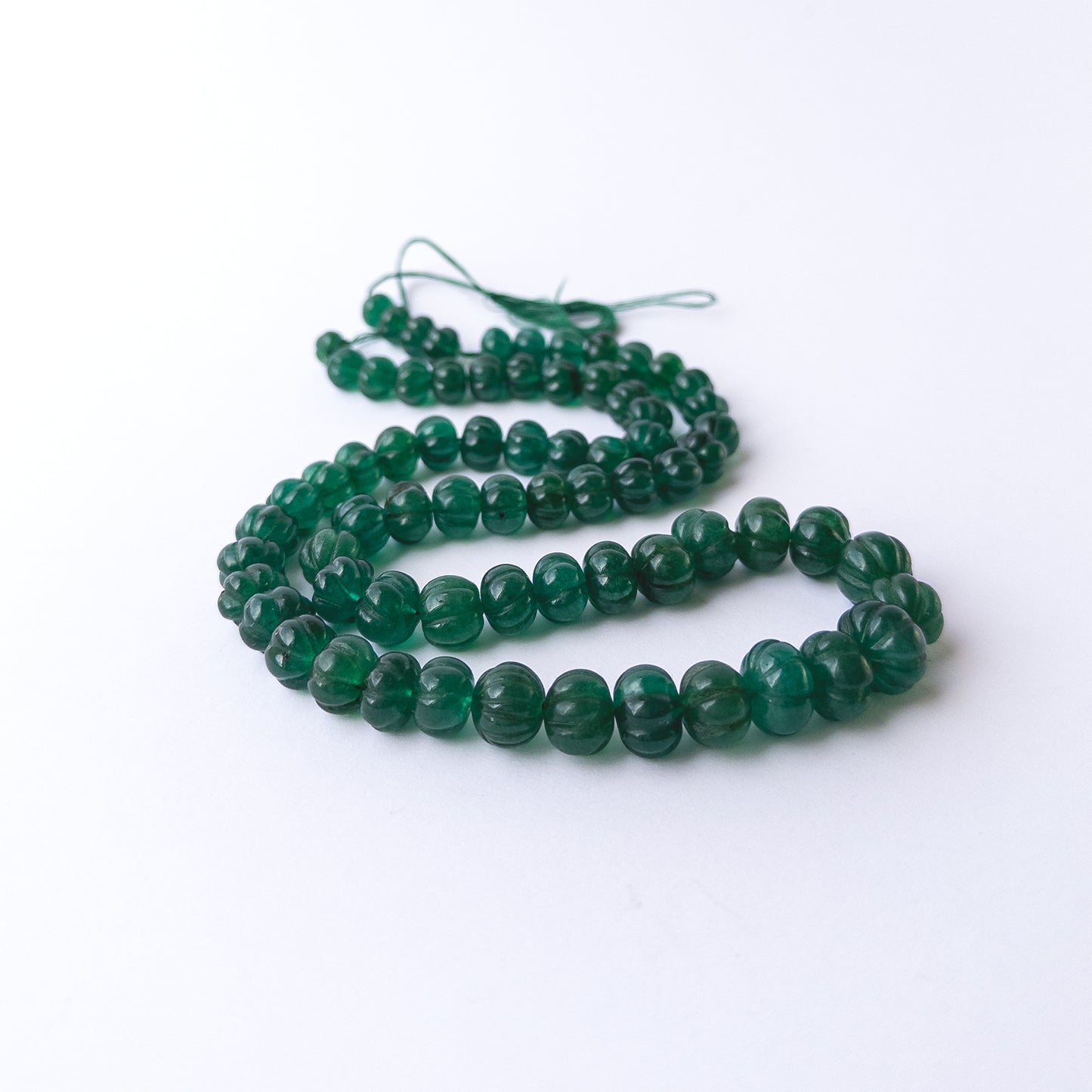 High quality Emerald carved pumpkin beads in 7.5–12.5mm sizes, perfect for handmade jewellery components.