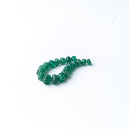 Authentic Emerald stone beads featuring carved pumpkin shapes that add texture and elegance to handmade jewellery designs.