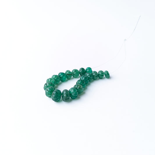 Authentic Emerald stone beads featuring carved pumpkin shapes that add texture and elegance to handmade jewellery designs.