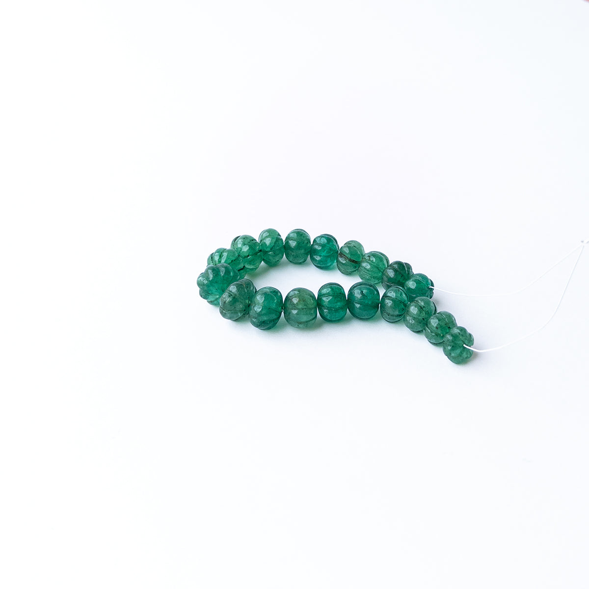 Handmade jewellery components crafted from Emerald carved pumpkin beads ideal for bespoke jewellery creations.