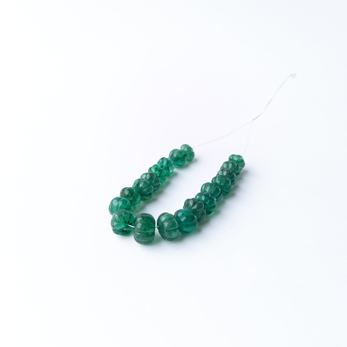 Luxury Emerald gemstone beads with carved pumpkin shapes perfect for necklaces earrings pendants and custom jewellery.