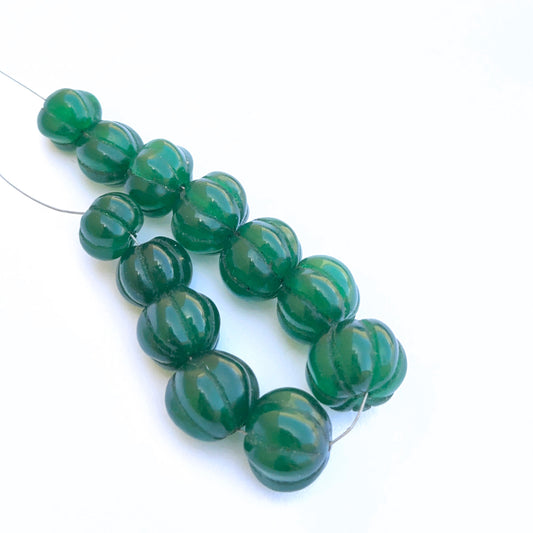 Emerald carved pumpkin beads with rich green tones for DIY jewellery.