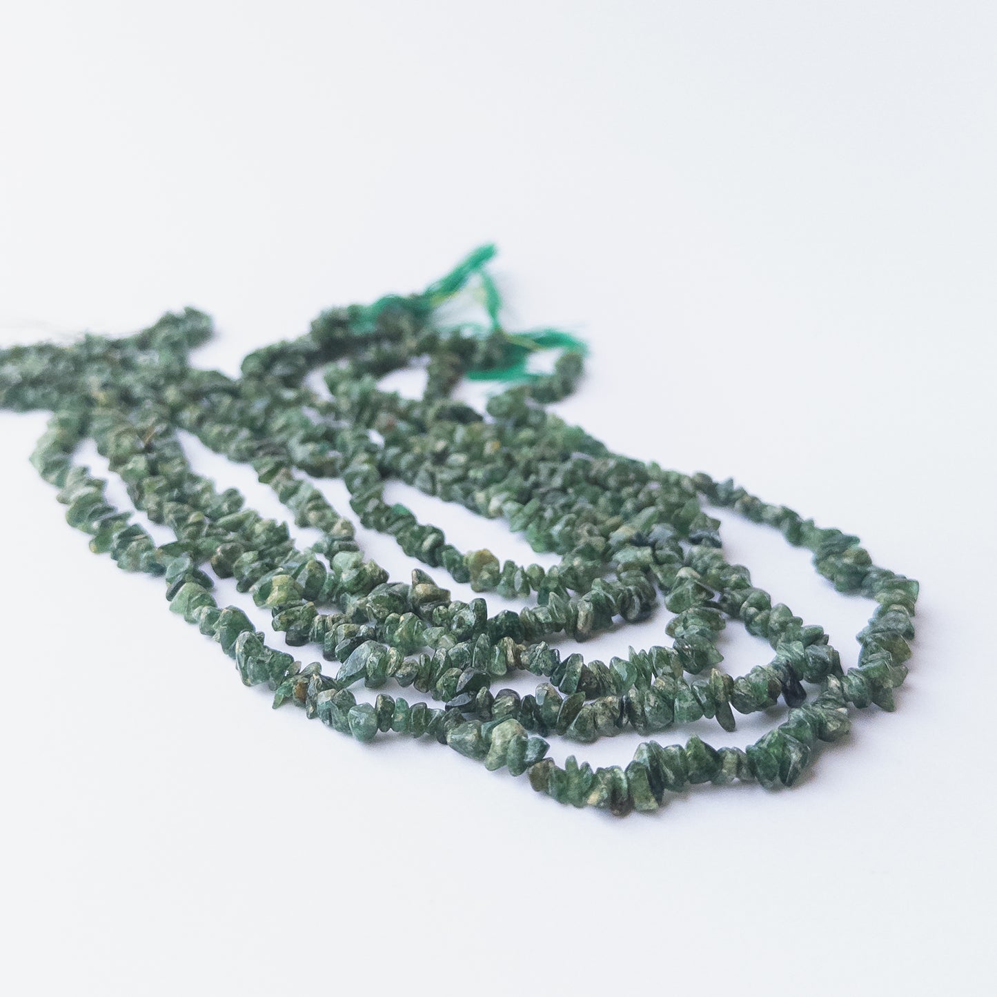 Shaded Emerald chip beads displaying natural colour gradients and high‑quality craftsmanship.