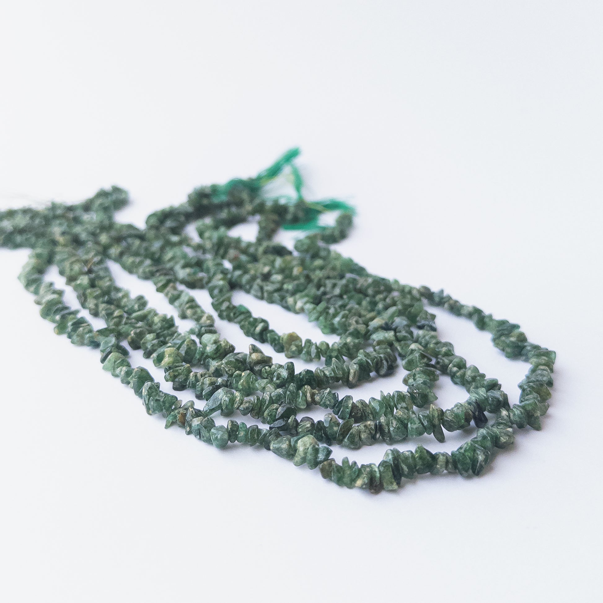 Shaded Emerald chip beads displaying natural colour gradients and high‑quality craftsmanship.