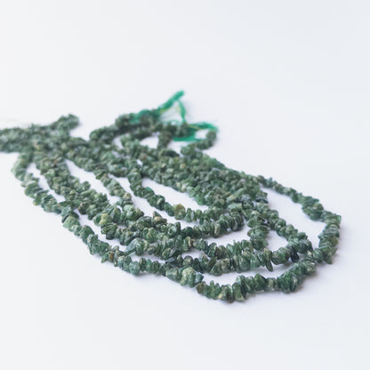 Shaded Emerald chip beads displaying natural colour gradients and high‑quality craftsmanship.