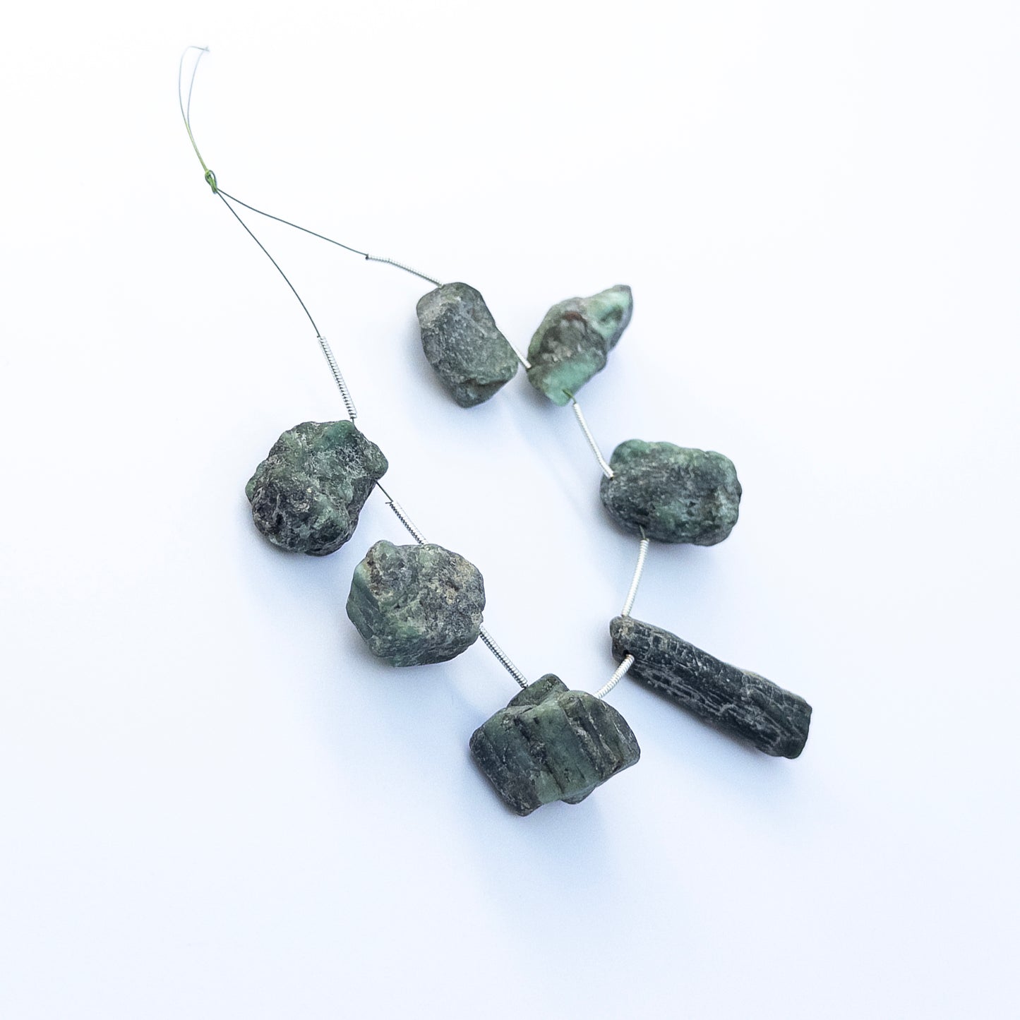 Genuine Emerald rough beads with drilled centres, ideal for handmade jewellery components and statement designs.
