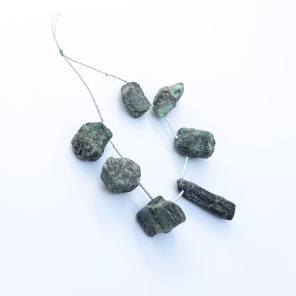 Genuine Emerald rough beads with drilled centres, ideal for handmade jewellery components and statement designs.