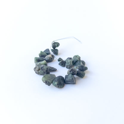 Emerald drilled rough gemstone beads in natural green tones, ideal for genuine stone bead jewellery making.