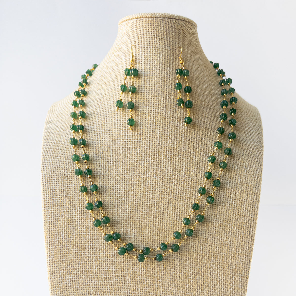 Authentic Emerald gemstone necklace and earrings displaying natural colour, carved detailing, and premium clarity for DIY jewellery makers.