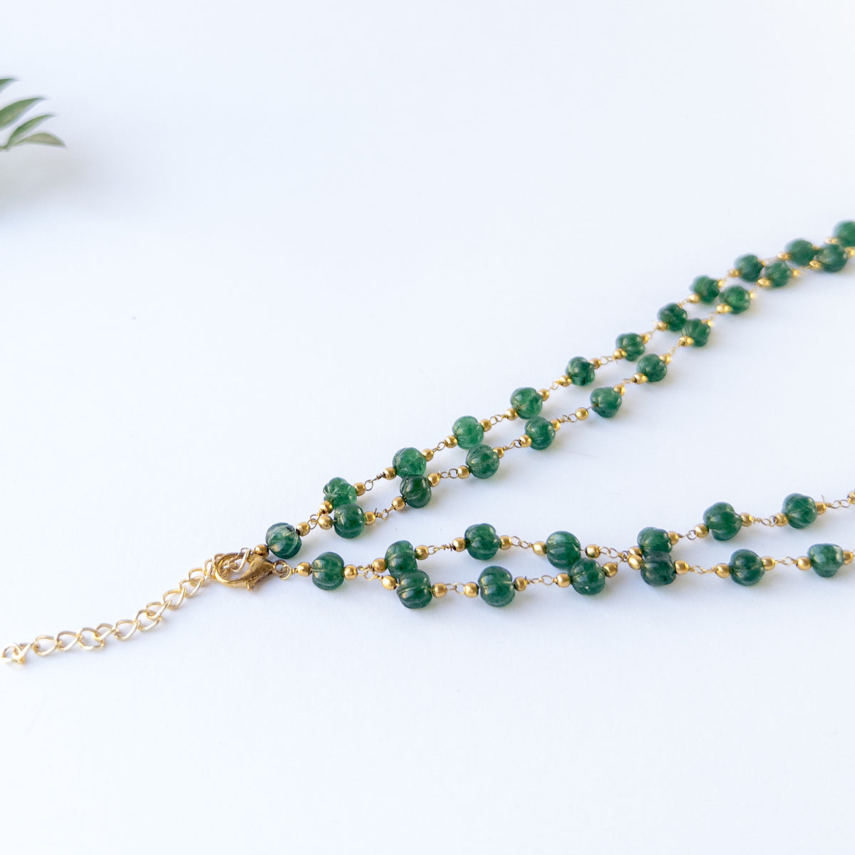 Genuine Emerald stone beads with sculpted pumpkin‑cut texture.