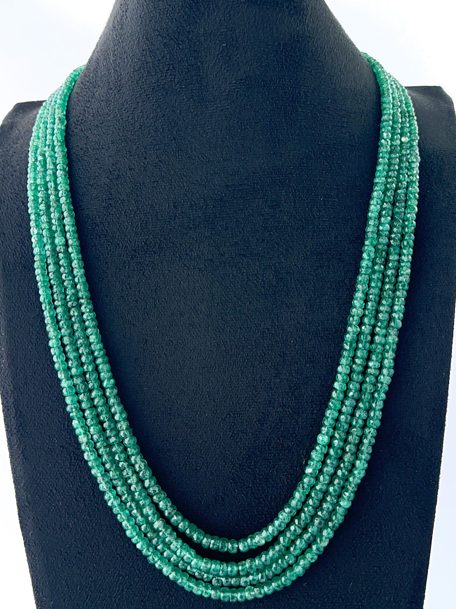 Four‑strand faceted rondelle emerald necklace with adjustable 47–52cm layering.