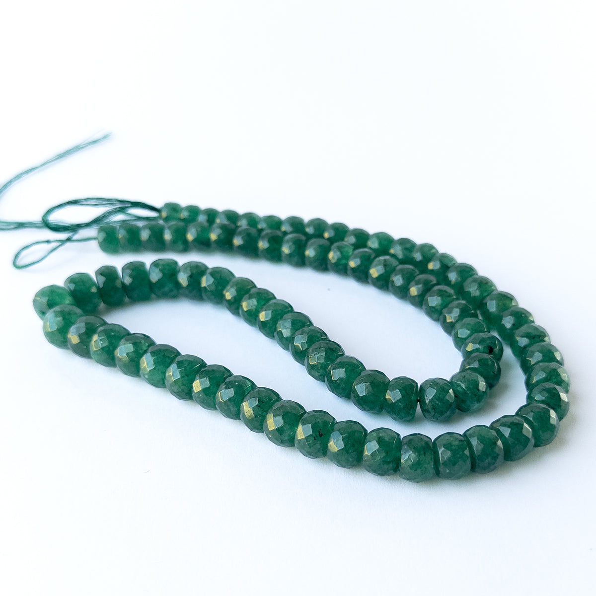 Handmade jewellery components featuring Emerald rondelles with consistent sizing and radiant shine.
