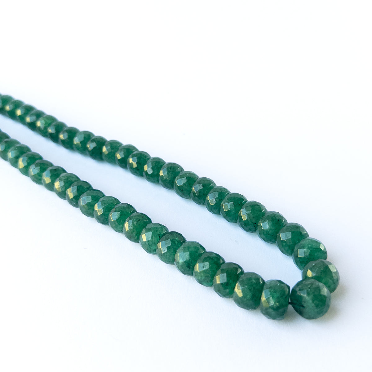 Emerald gemstone beads with bright sparkle and refined faceting for premium stone bead designs.