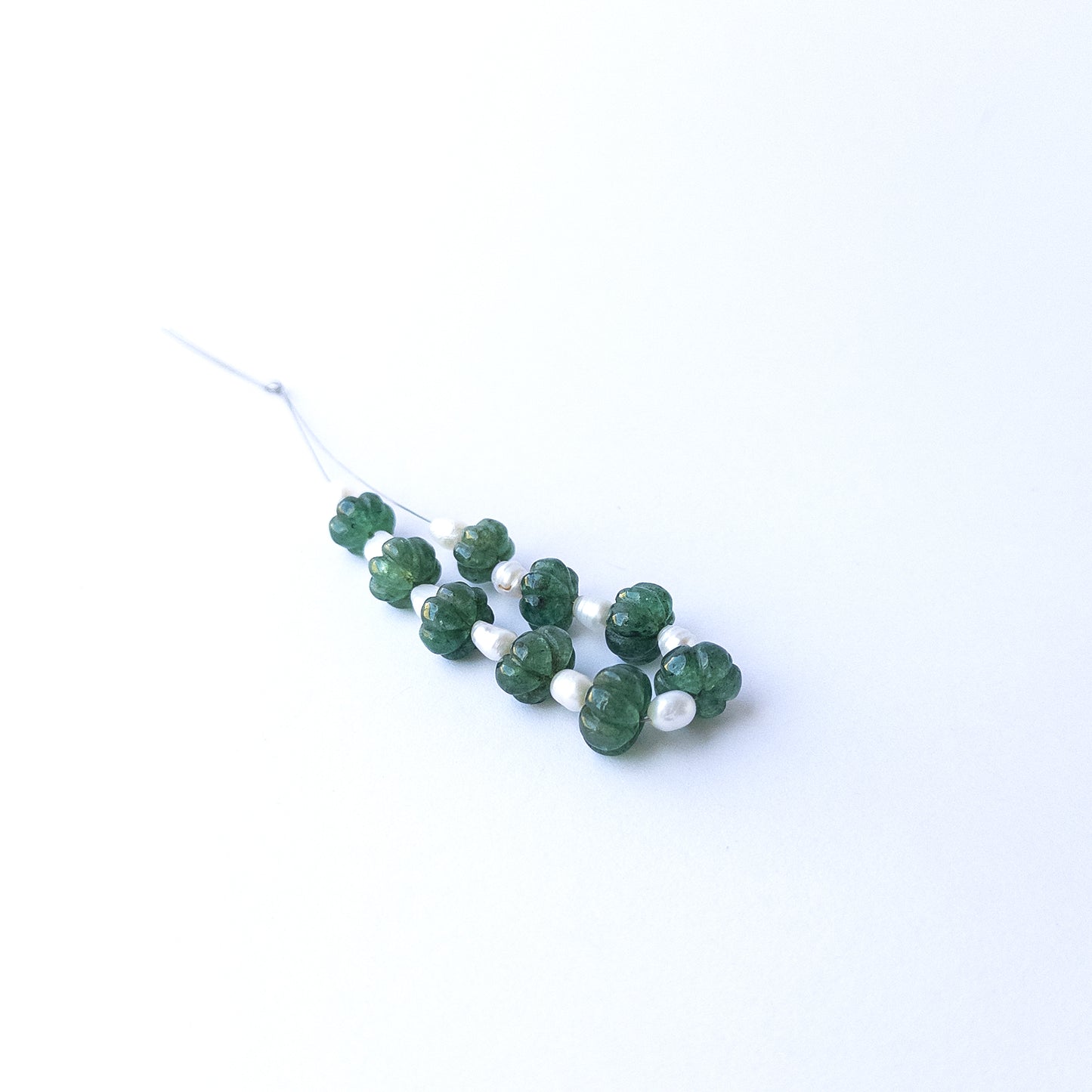 Elegant emerald and freshwater pearl beads in pumpkin cut, perfect for gemstone beads for DIY jewellery projects.