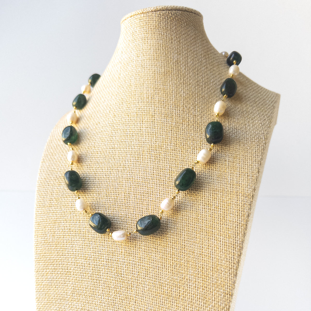 Authentic Emerald and Pearl gemstone jewellery set displaying natural colour, organic shaping, and premium clarity.