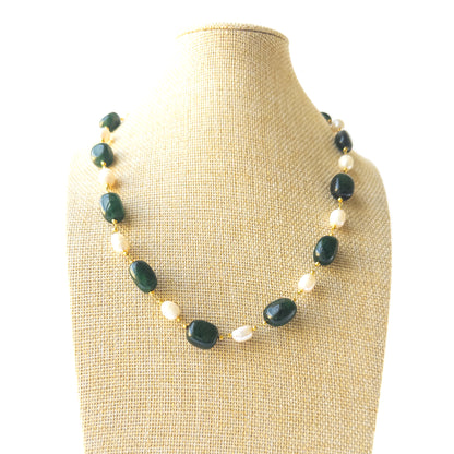 Genuine Emerald beads with smooth‑tumble shaping paired with lustrous Freshwater Pearls in a coordinated necklace and earrings set.