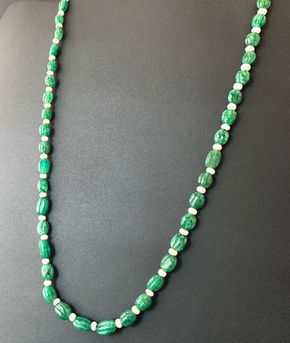 Emerald necklace with carved oval natural gemstone beads, 9–11mm x 6.5–8mm, polished shine and vivid green colour.