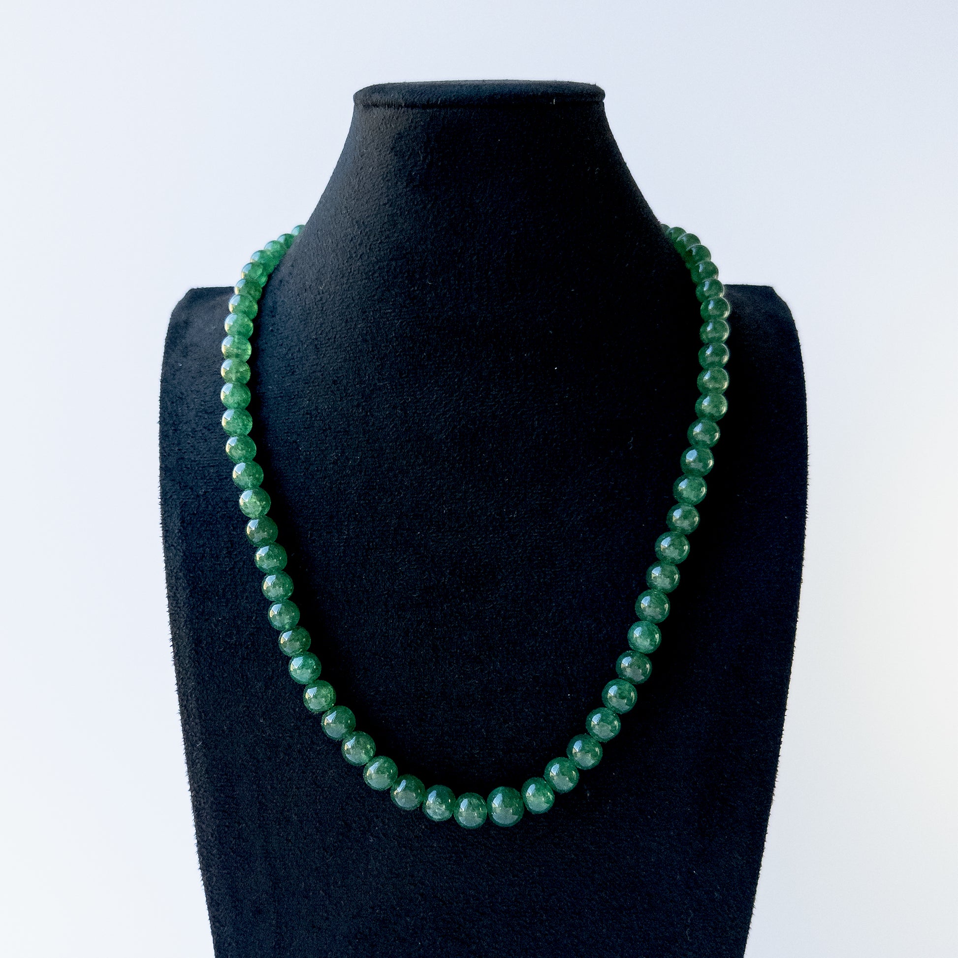 Authentic Emerald stone beads showcasing deep green tones and smooth round finish for jewellery designers.